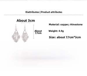 Detail view of silver tassel earrings with crystal hollow leaves and multi-layer fringe
