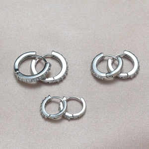 Three pairs of elegant silver hoop earrings with micro-paved zircons in various sizes