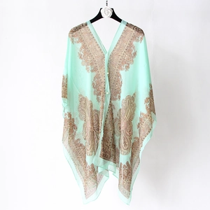 Detail of mint green paisley print silk chiffon shawl with vintage floral pattern