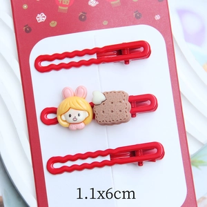 Detailed view of red hair clips set with cartoon girl and cute bread resin charms