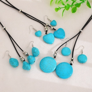 Boho turquoise jewelry sets with heart and round pendants on black cord necklaces