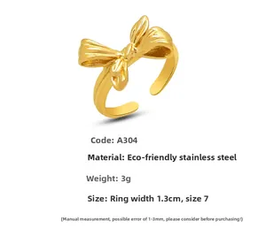 Macro shot showing size 7 measurements and weight for the gold bow stainless steel ring
