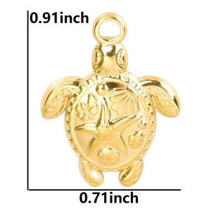 Detailed macro view of 18k gold turtle pendant with shell relief and size markings