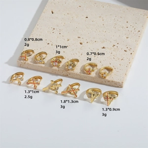 Exquisite gold floral and animal stud earrings with zircon inlays in minimalist style