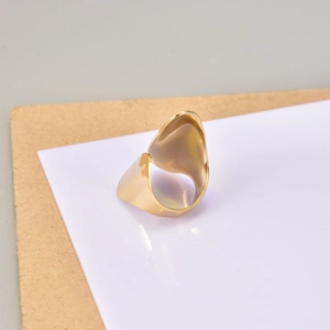 Detailed view of wide 18K gold plated minimalist wrap ring with high polished finish