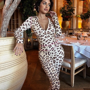 Detail view of leopard print hooded top and leggings with pink stitching accents