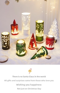 Close-up of assorted Christmas lanterns with snowflake and reindeer patterns in warm light