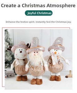 Close-up of champagne gold Christmas plush dolls with sequined hats and golden embroidery