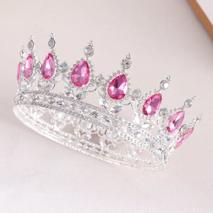 Detail of silver bridal crown with pink teardrop crystals and white rhinestones