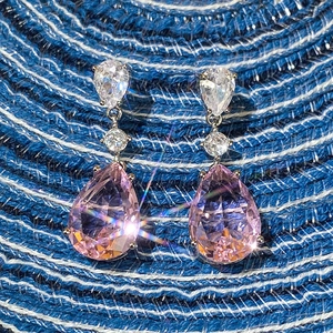 Elegant pink pear-cut zircon teardrop earrings with silver prong setting and sparkling stones