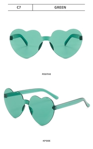 Front and side views of green heart-shaped jelly sunglasses in rimless one-piece design