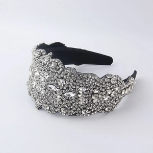Baroque style wide headband with sparkling crystal rhinestones on a black base