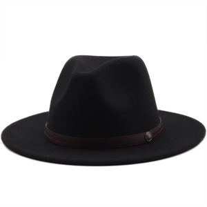 Close-up of black wool felt fedora hat featuring a brown leather belt and metal badge