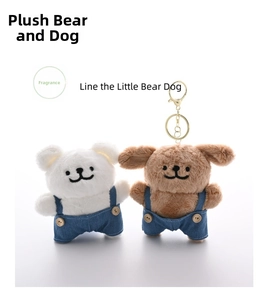 Detail of plush dog and bear keychains wearing denim overalls with wooden buttons
