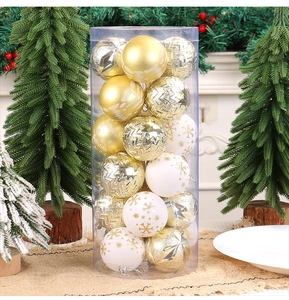 Macro detail of assorted gold and white Christmas ornaments with glitter patterns and textures