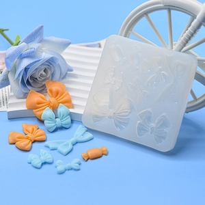 Bow and candy shaped silicone fondant mold for cake decorating and DIY clay crafts