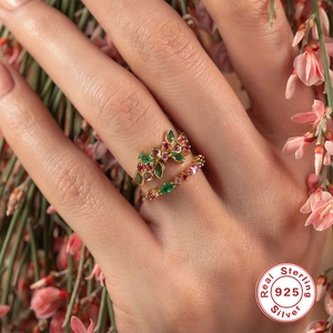 S925 sterling silver ring set with green turquoise and pink gems on model finger