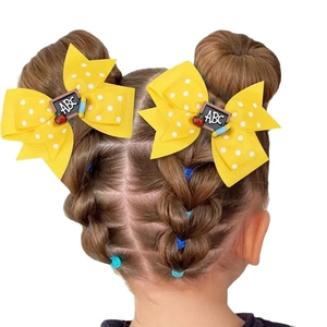 Yellow polka dot hair bows with ABC blackboard and apple charms for school girls