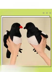 Detailed close-up of a pair of plush magpie toys with soft black and white fur texture