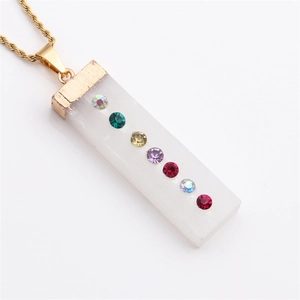 Seven chakra white crystal pendant necklace with golden finish and colorful rhinestones