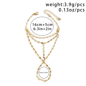 Detailed size chart showing golden multi-layer bracelet with ring and measurements