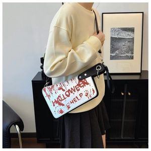 Close-up of Halloween crossbody bag featuring red blood splatter print and Help text