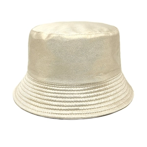 Detail shot of the shimmering champagne gold texture on the laser finish bucket hat