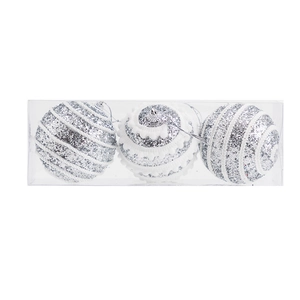 Detailed view of silver Christmas ornaments with glitter patterns in a clear box