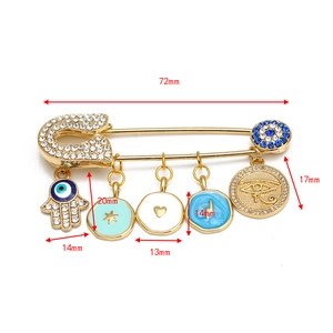 Detailed size view of gold Hamsa and Evil Eye charms pin with 72mm length dimension