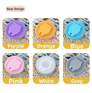 Detailed view of portable silicone folding cups with cute bear lids in six vibrant colors
