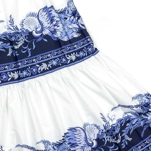 Detail of blue and white floral porcelain print and pleated stitching on the swimsuit