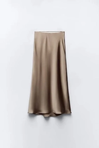 Detail of coffee satin midi skirt showing smooth silk texture and elegant high-waist drape