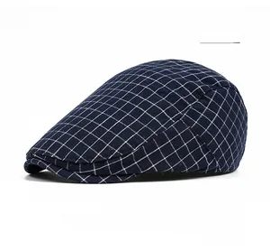 Detailed view of navy blue plaid pattern on a flat cap with classic British style