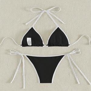 Minimalist black and white contrast color bikini set with halter top and side-tie bottom