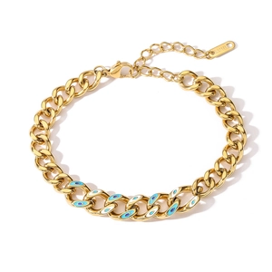Gold plated stainless steel Cuban chain bracelet featuring enamel evil eye charms
