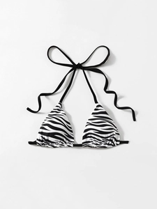 Detail of zebra print triangle bikini top with halter neck ties and ruffled edges