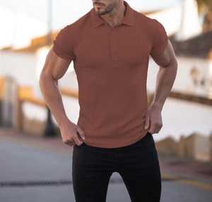 Detailed close-up of men's slim fit polo shirt featuring vertical knit texture in reddish brown