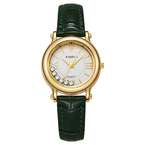 Elegant women's quartz watch with gold case, moving diamonds, and green leather strap