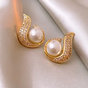 Elegant gold plated mermaid pearl stud earrings with sparkling zircon fish tail accents