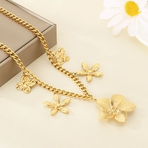 Detail shot of golden stainless steel multi-flower pendants with textured petals