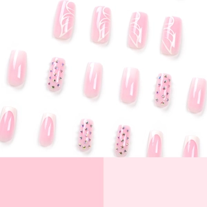 Pink gradient French press on nails set with white fluid lines and small rhinestones