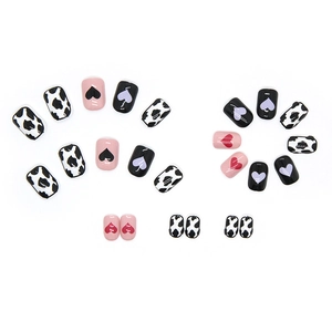 Cow print and heart pattern press-on nail set with 24 pieces of glossy nail tips