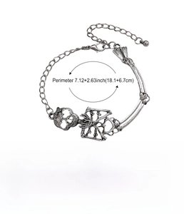 Detail view of silver skull hand bracelet with adjustable chain and technical dimensions
