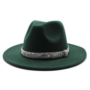 Close-up of dark green wool fedora hat featuring a sparkling silver rhinestone band decoration