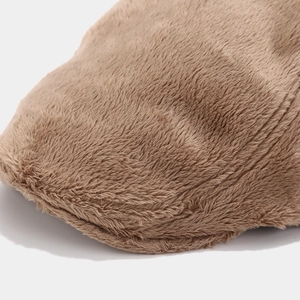 Close-up of the soft plush texture and detailed stitching on a light brown beret hat