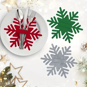 Christmas snowflake felt cutlery holders in red, green and grey for festive table decor