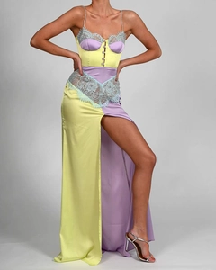 Detail of yellow and lavender satin dress with lace trim and rhinestone straps
