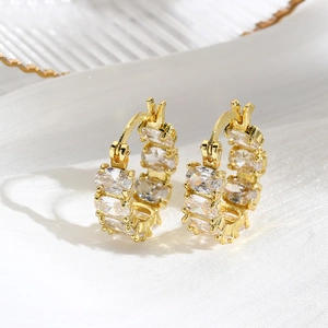 Close-up of 18k gold plated hoop earrings with micro-pave square zircon details