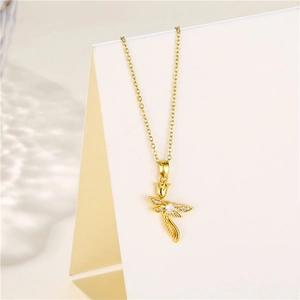 Macro view of gold dragonfly and tulip pendant necklace with shimmering zircon stones