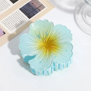 Blue and yellow gradient floral hair claw clip in matte finish on white background